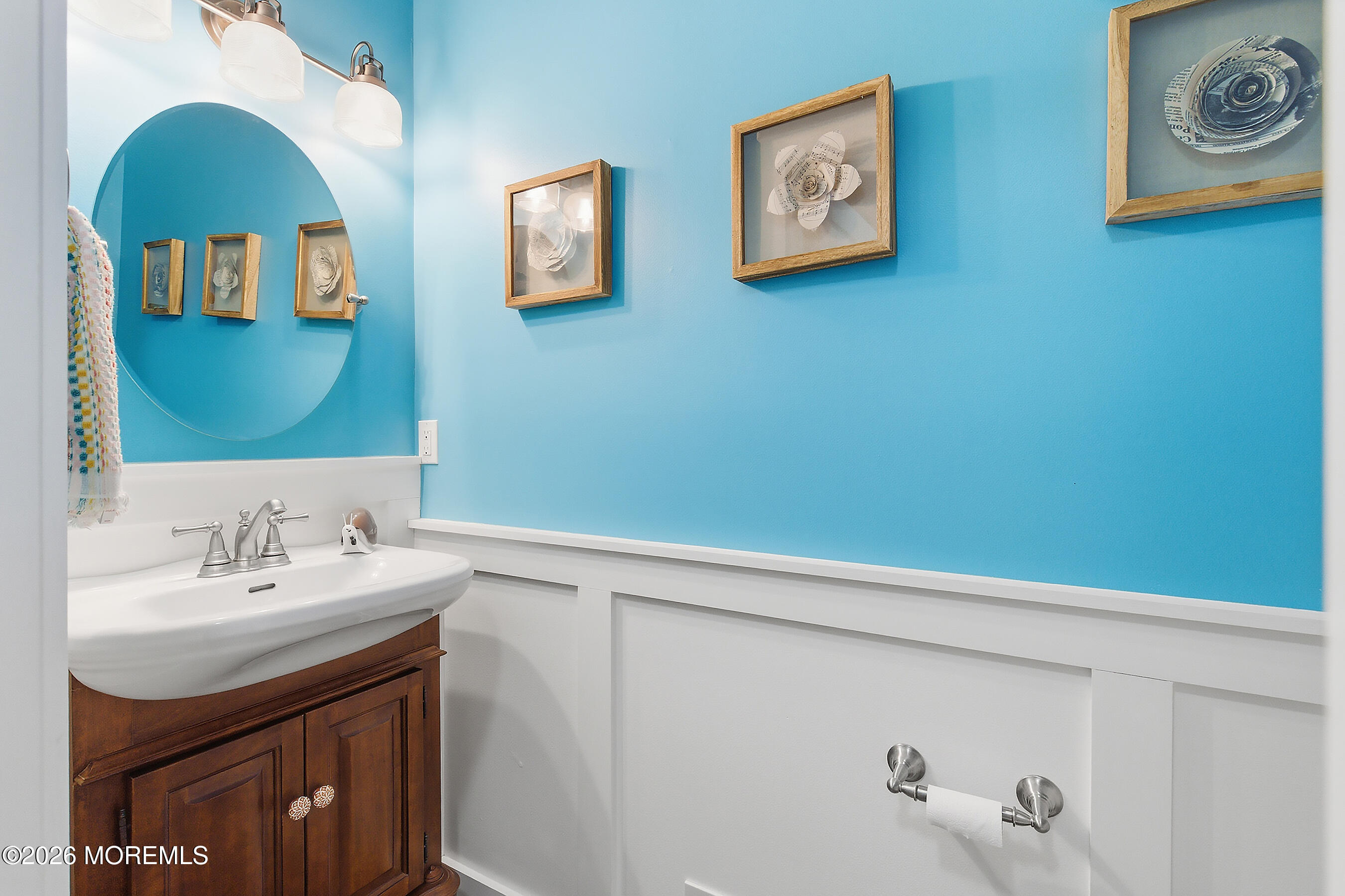 197 Inlet Avenue Manahawkin, NJ 08050 - Photo 21 of 36 a bathroom with a sink and a mirror
