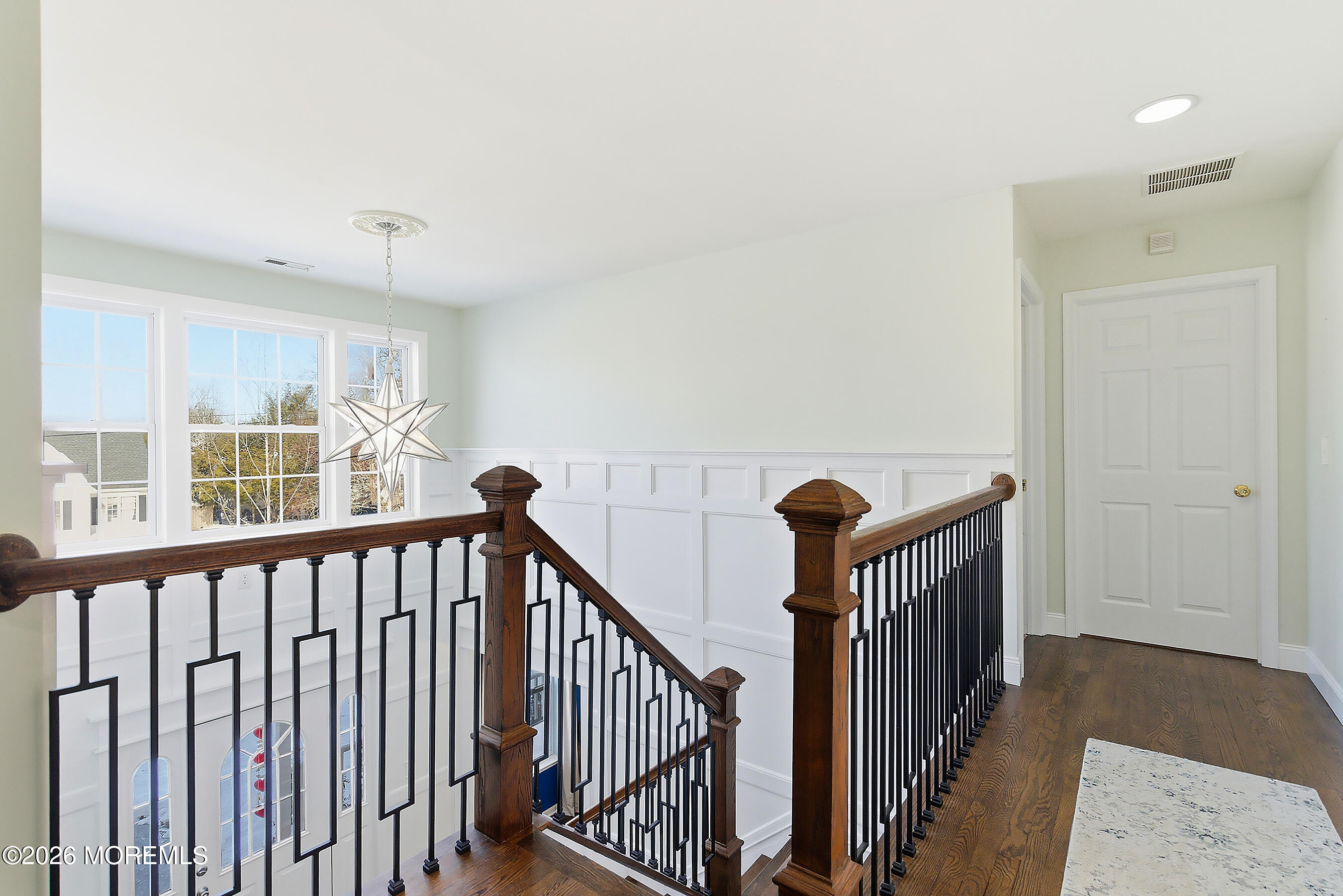 197 Inlet Avenue Manahawkin, NJ 08050 - Photo 24 of 36 a view of a hallway with wooden floor and windows