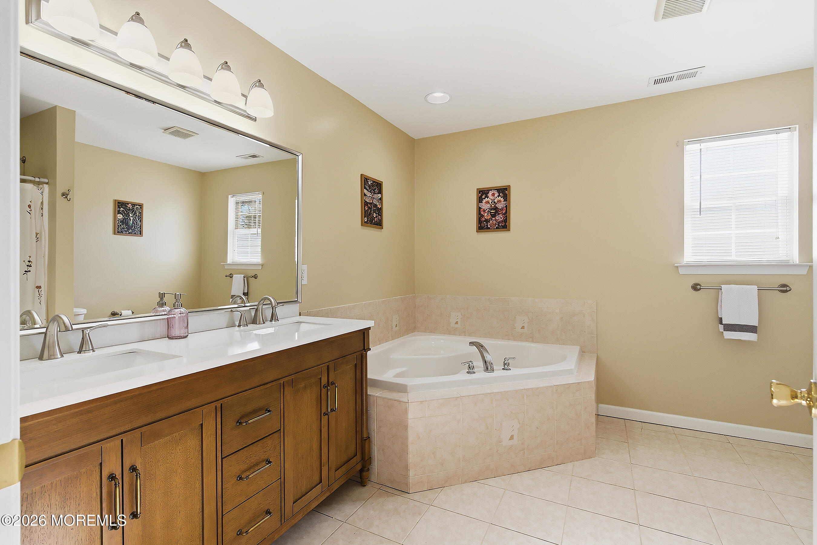 197 Inlet Avenue Manahawkin, NJ 08050 - Photo 26 of 36 a bathroom with a tub double sink and mirror