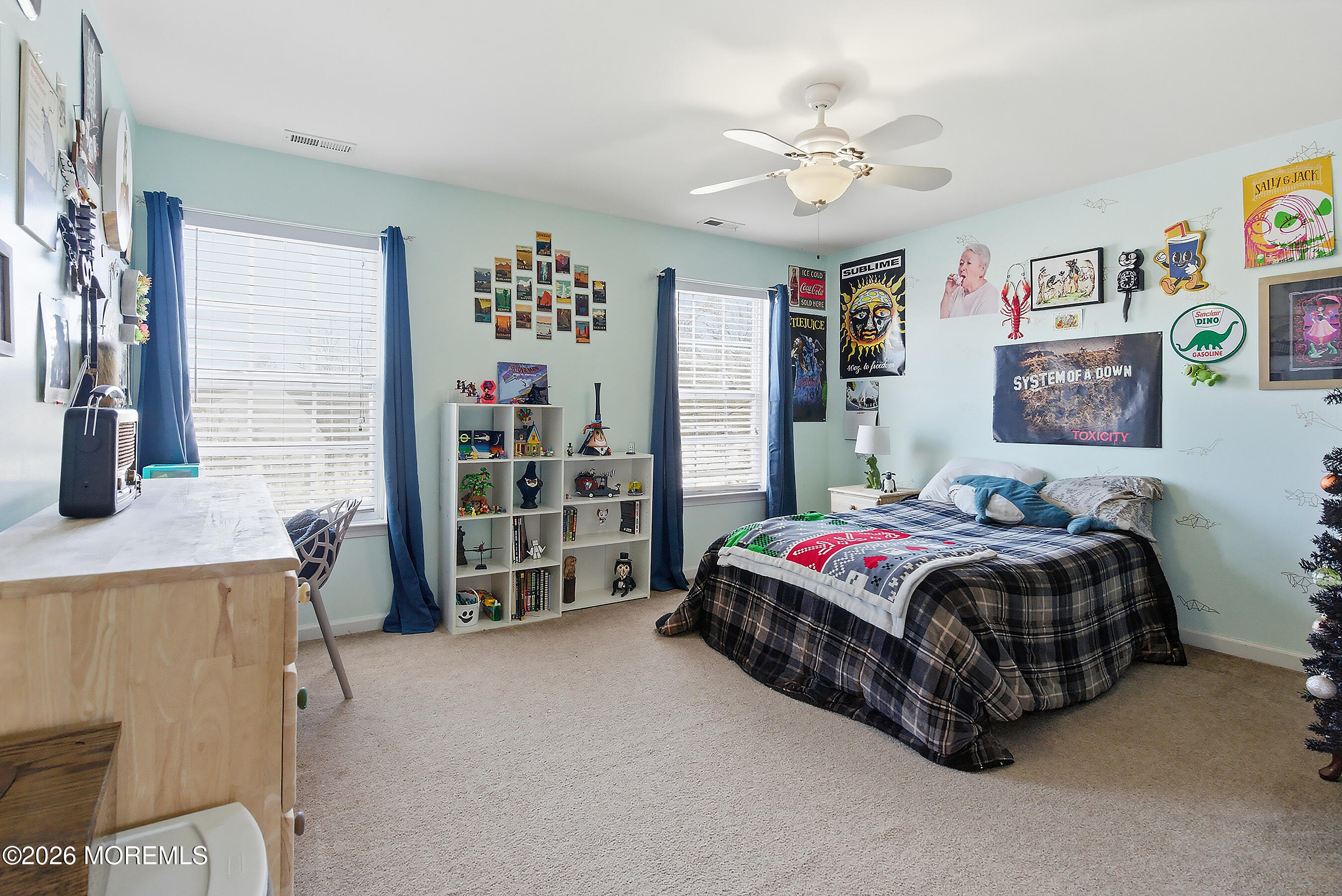 197 Inlet Avenue Manahawkin, NJ 08050 - Photo 29 of 36 a spacious bedroom with a bed and a chandelier