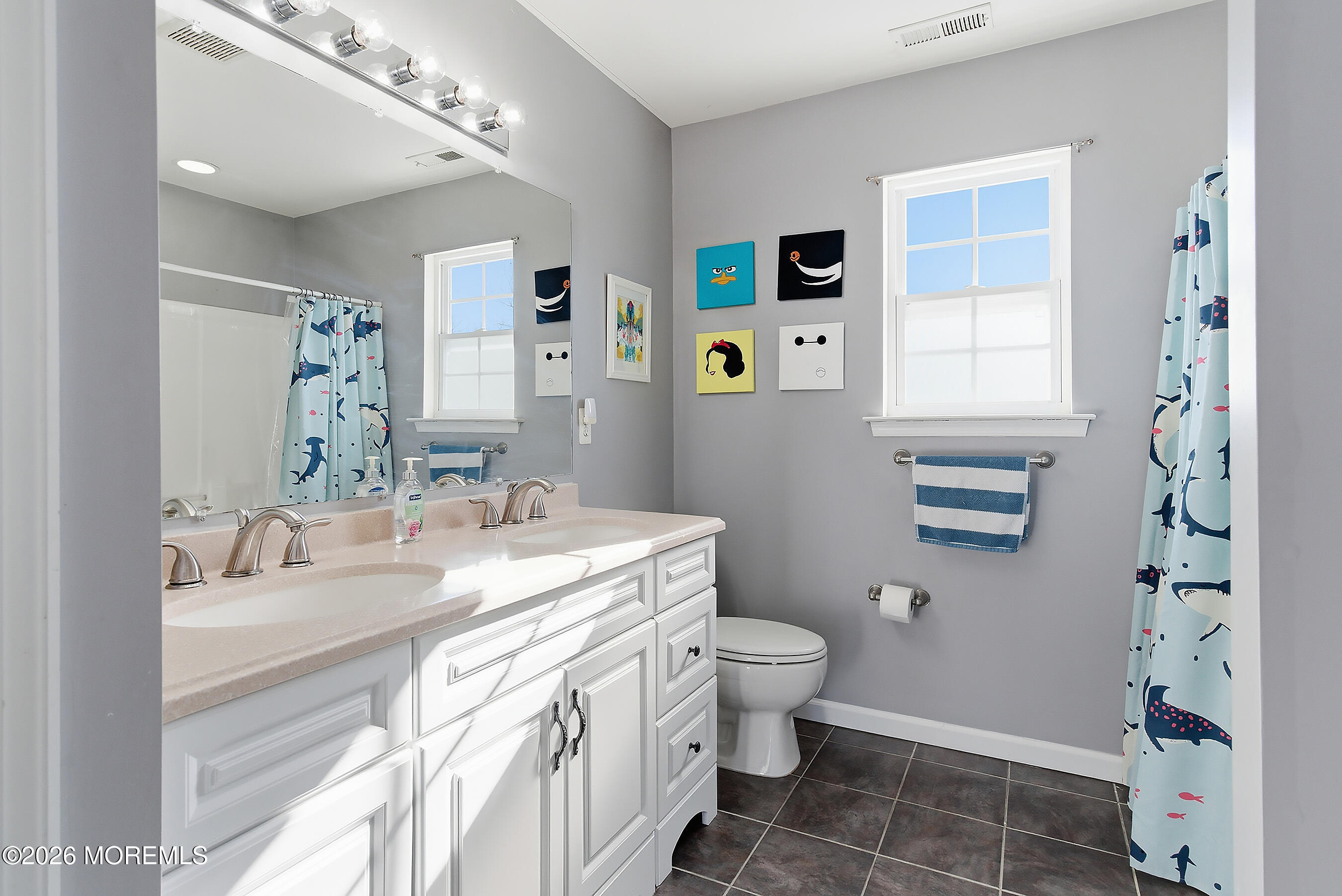 197 Inlet Avenue Manahawkin, NJ 08050 - Photo 31 of 36 a bathroom with a sink toilet and shower
