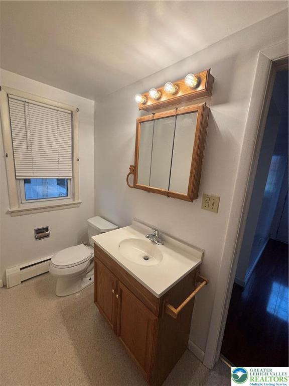 257 East 2nd Street Wind Gap, PA 18091 - Photo 4 of 14 a bathroom with a toilet a sink and mirror