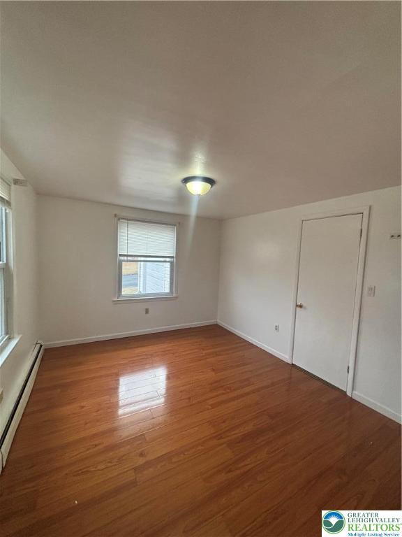 257 East 2nd Street Wind Gap, PA 18091 - Photo 10 of 14 an empty room with wooden floor and windows