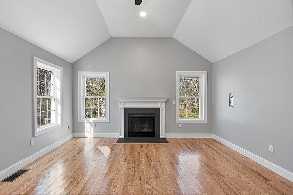 178 French Road, Unit LOT 8 Templeton, MA 01468 - Photo 21 of 39 an empty room with wooden floor fireplace and windows