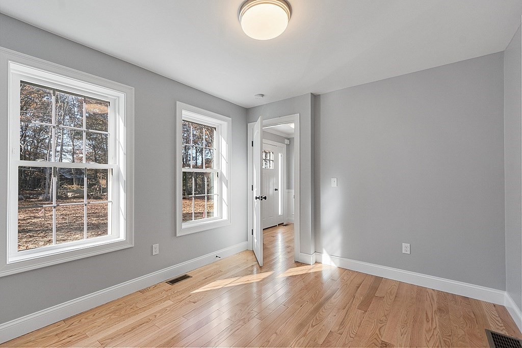 178 French Road, Unit LOT 8 Templeton, MA 01468 - Photo 24 of 39 a view of an empty room with wooden floor and a window