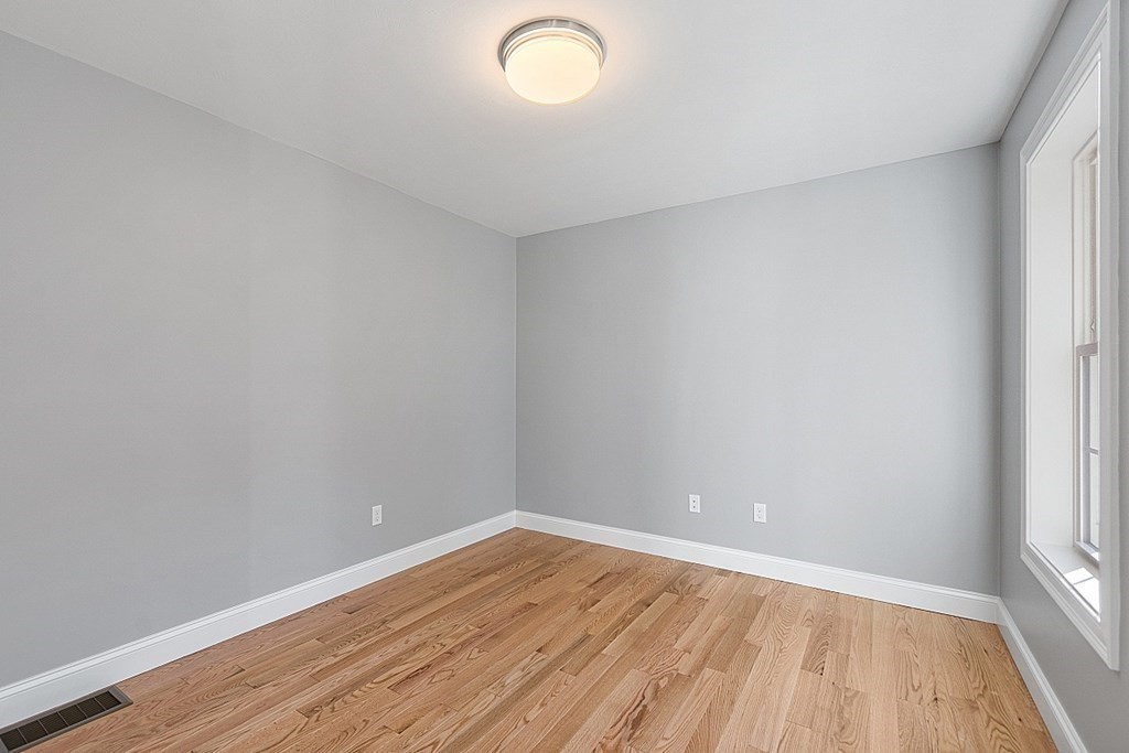 178 French Road, Unit LOT 8 Templeton, MA 01468 - Photo 25 of 39 a view of an empty room with wooden floor and a window