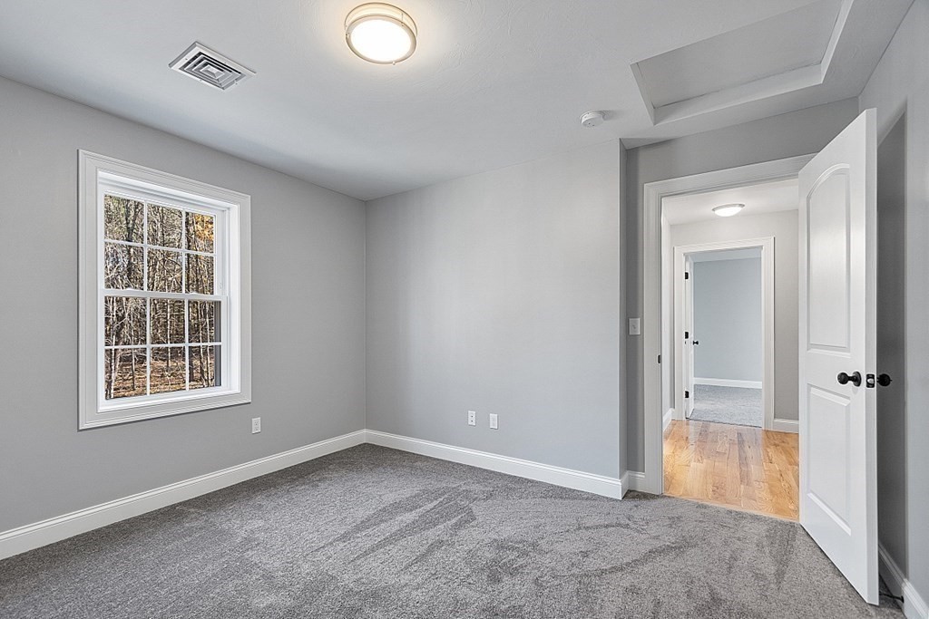 178 French Road, Unit LOT 8 Templeton, MA 01468 - Photo 35 of 39 an empty room with windows and closet