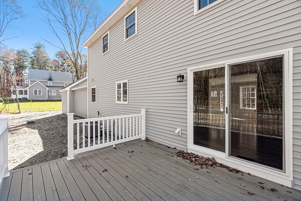 178 French Road, Unit LOT 8 Templeton, MA 01468 - Photo 8 of 39 a view of a house with a wooden deck