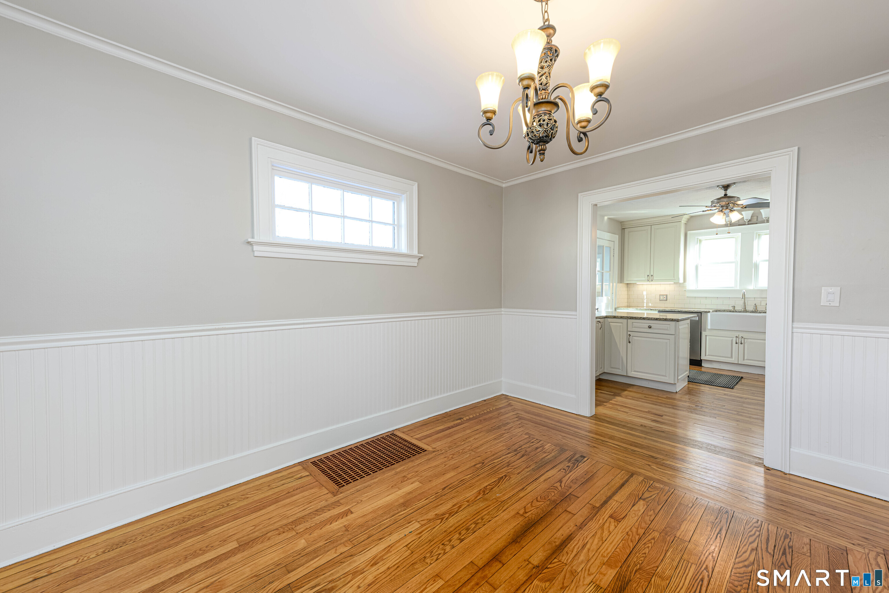 18 Day Spring Avenue Hamden, CT 06518 - Photo 14 of 35 The oversized doorway into the kitchen provides an open concept feel, yet the spaces are distinct.