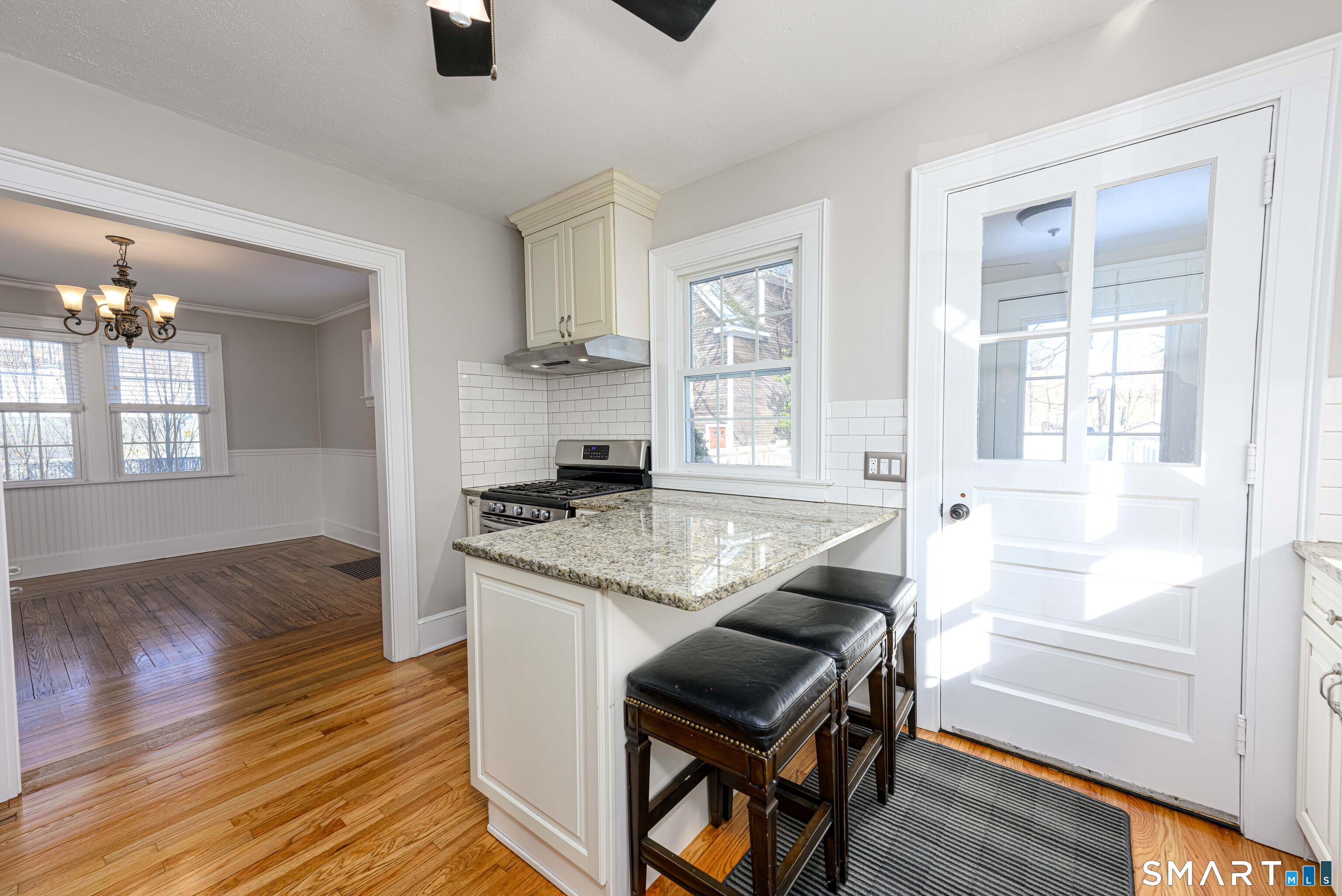 18 Day Spring Avenue Hamden, CT 06518 - Photo 16 of 35 Breakfast bar/pennisula seating. Notice how the light just streams in!