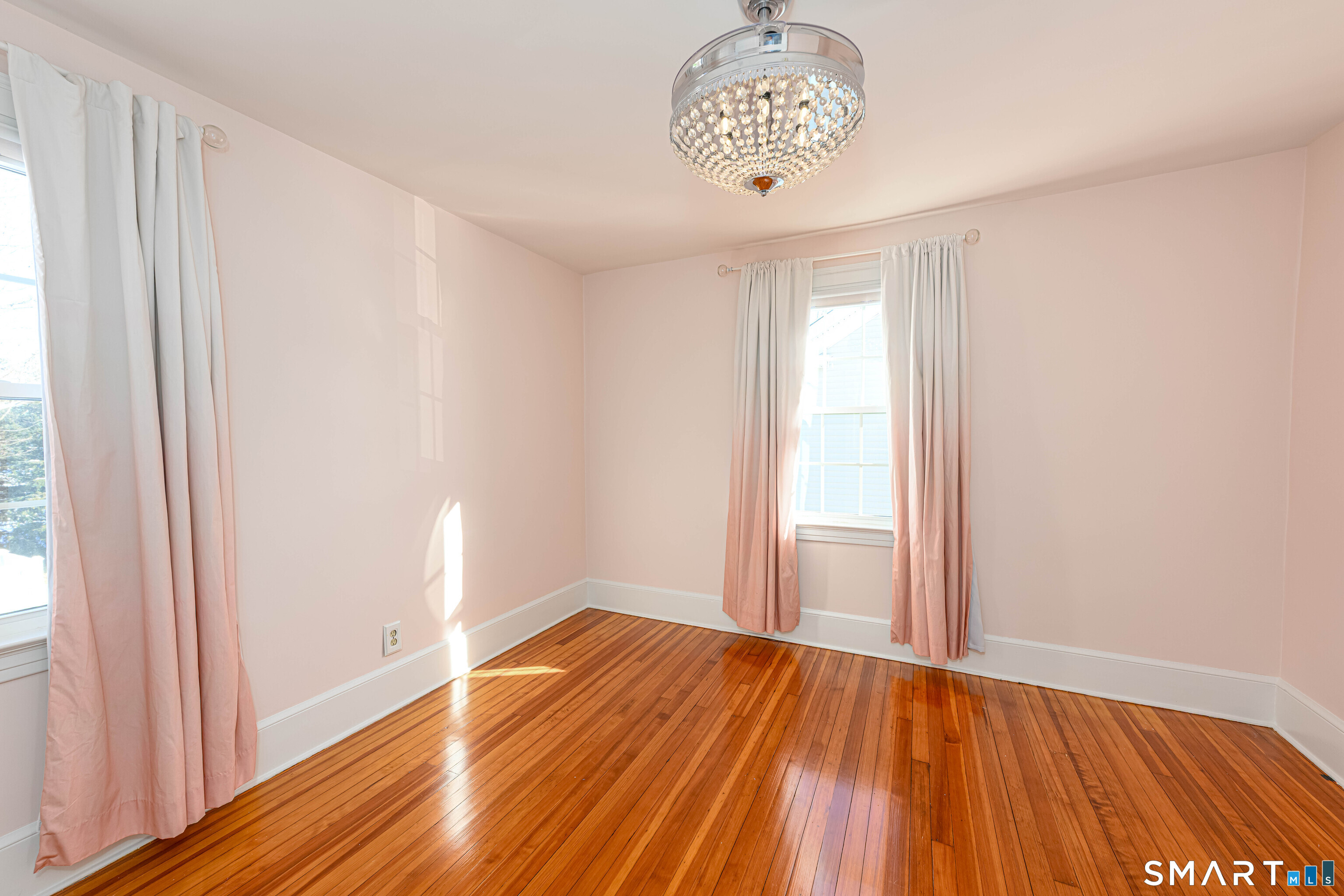 18 Day Spring Avenue Hamden, CT 06518 - Photo 23 of 35 Sweet bedroom with custom window treatments and chandelier/fan.
