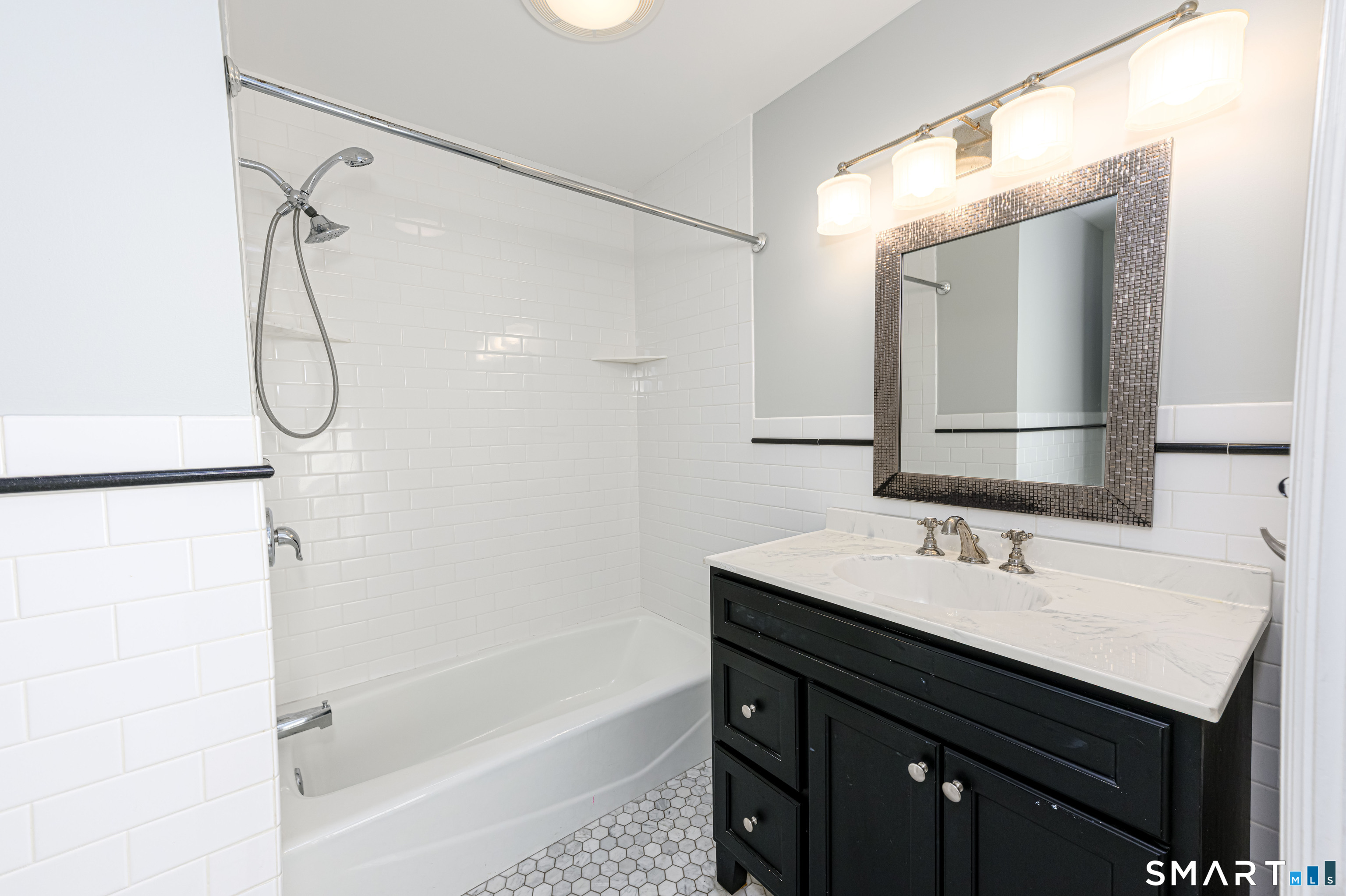 18 Day Spring Avenue Hamden, CT 06518 - Photo 27 of 35 Remodeled full bath with tub/shower combination and timeless finishes!