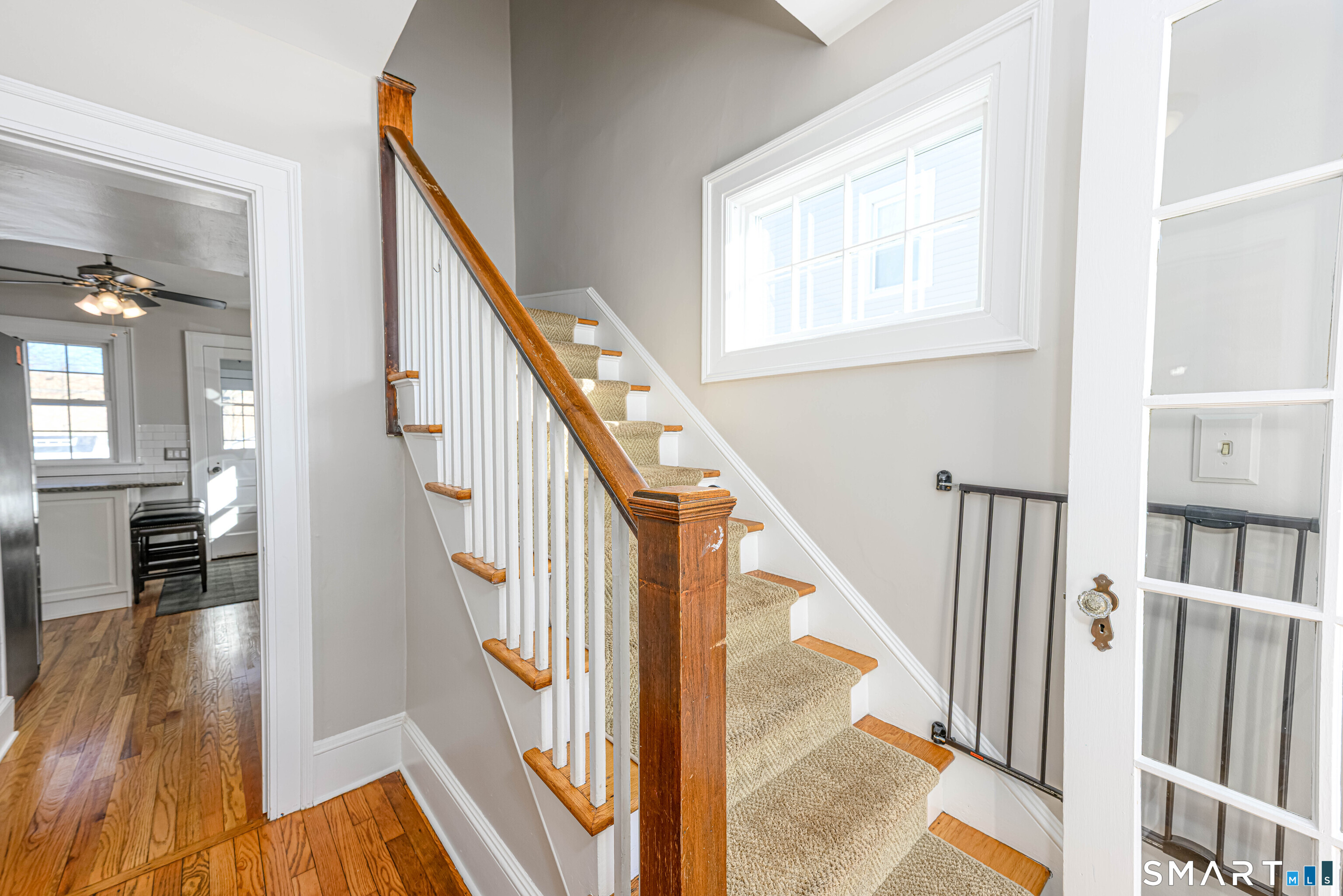 18 Day Spring Avenue Hamden, CT 06518 - Photo 6 of 35 Generously proportioned inner foyer which opens to handsome staircase and living room. Center hall to kitchen.