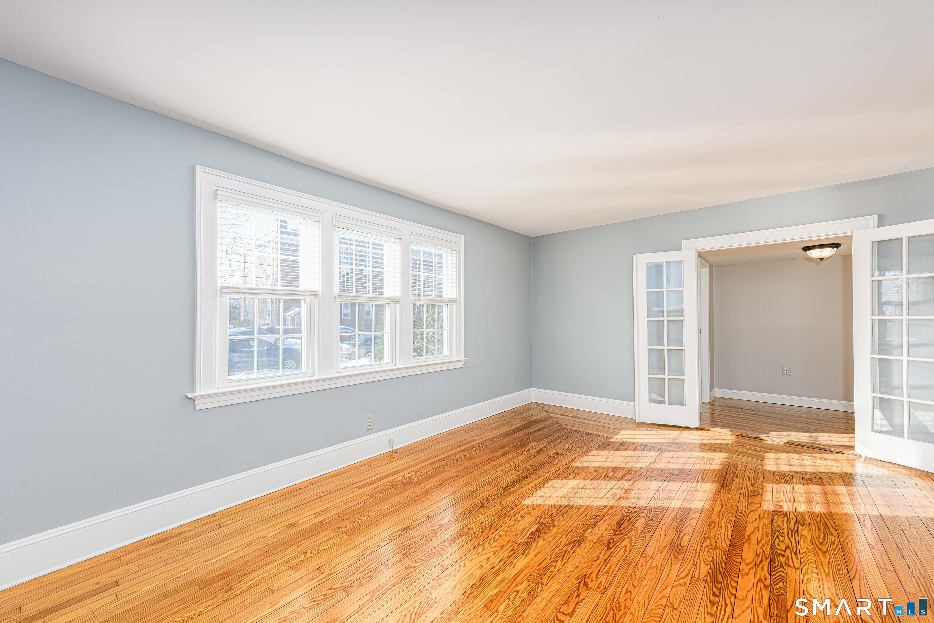 18 Day Spring Avenue Hamden, CT 06518 - Photo 8 of 35 Such a warm and welcoming space, light floods through this home. The hardwood is gleaming!