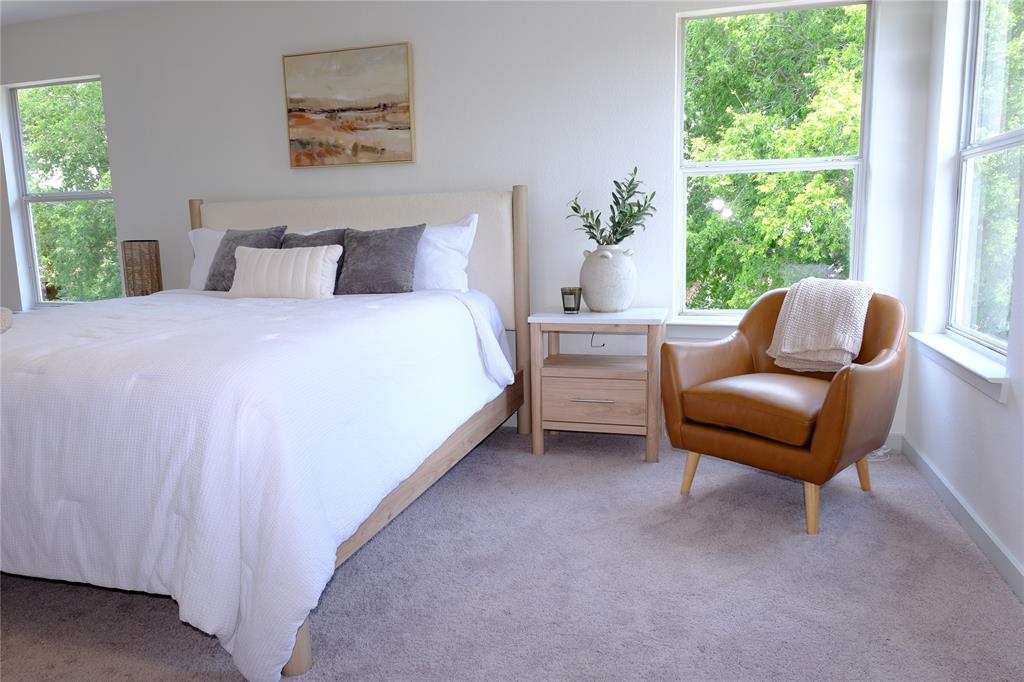 3437 Caprock Ranch Road Fort Worth, TX 76262 - Photo 20 of 27 a bedroom with a bed and a couch