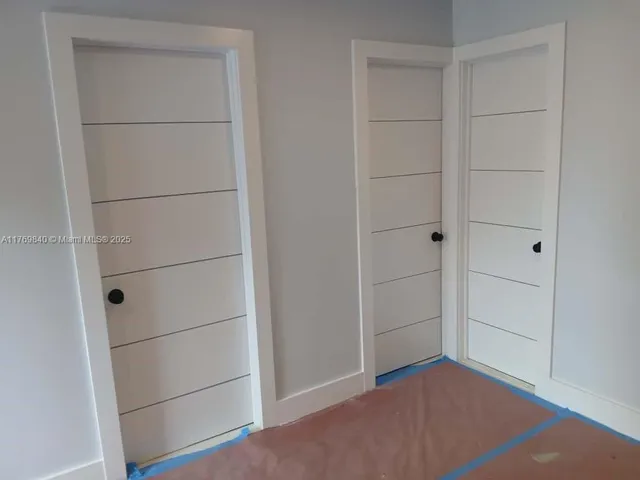 a view of an empty walk in closet