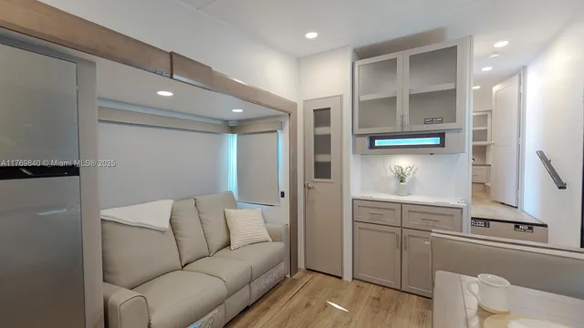 a bathroom with a glass door shower and a sink