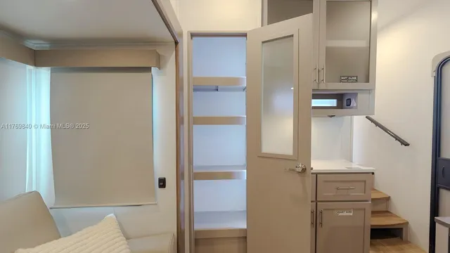 a bathroom with a shower and a sink