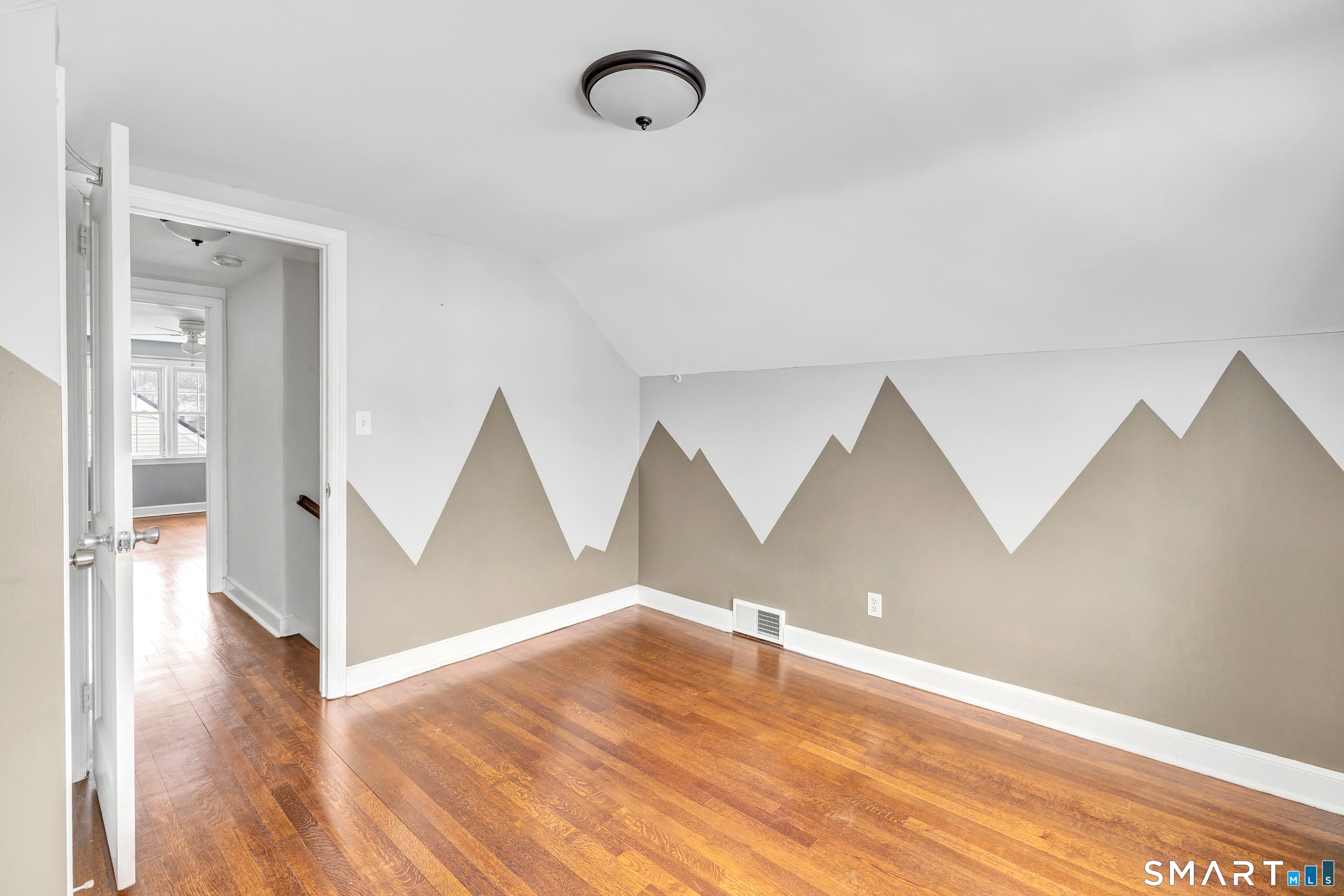 115 Spring Street Stratford, CT 06614 - Photo 3 of 26 a view of room with wooden floor