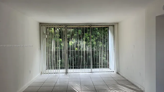 a view of a room that has a bed