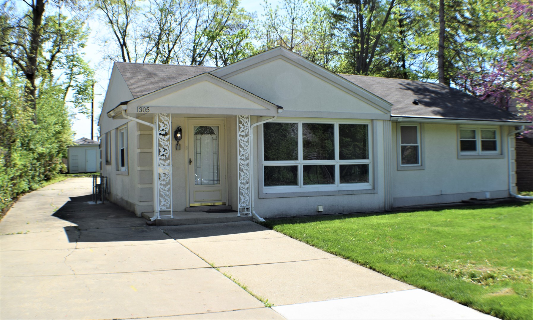 1305 1st Street Northbrook, IL 60062 - Photo 1 of 1 a front view of a house with a yard