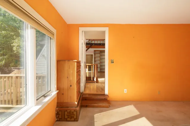 a view of a door and wooden floor