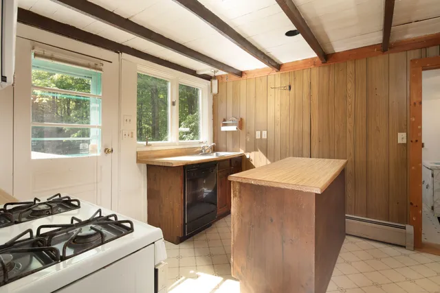 a utility room with a sink dryer and washer