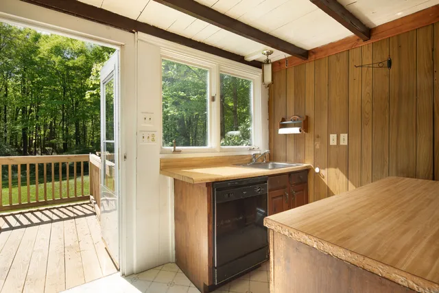 a kitchen that has a sink and a stove in it