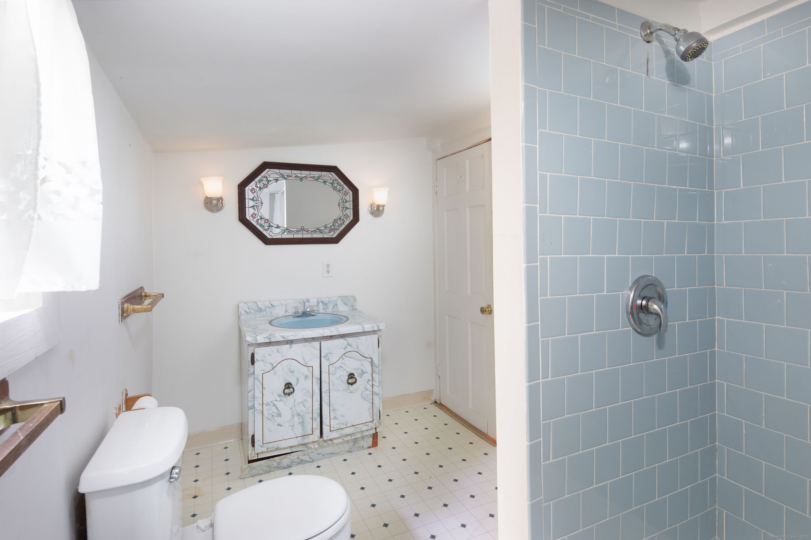 47 East Main Street Salisbury, CT 06068 - Photo 21 of 27 a bathroom with a toilet a sink and a mirror