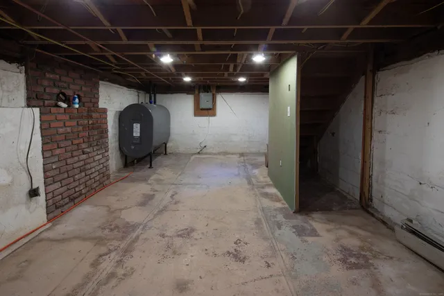 a view of empty room with a fireplace
