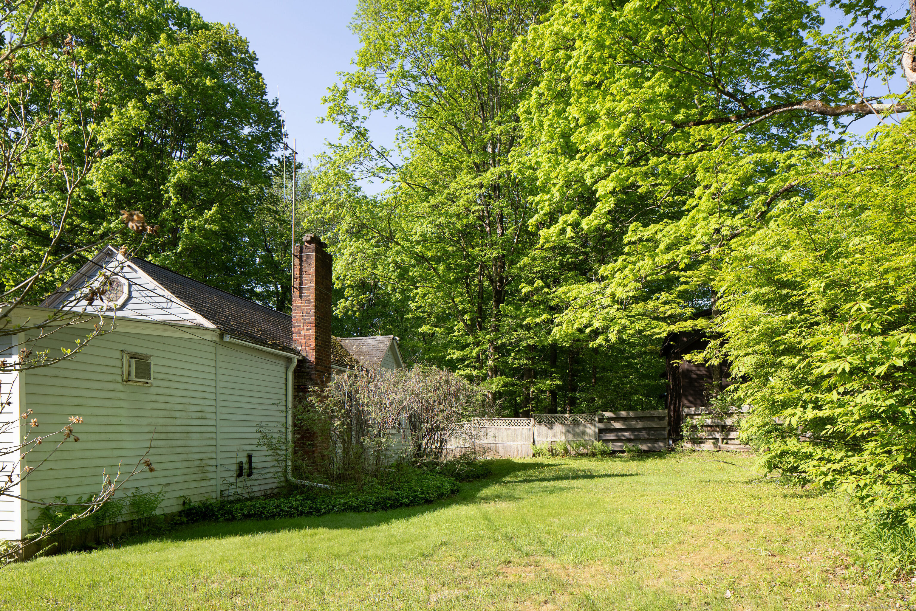 47 East Main Street Salisbury, CT 06068 - Photo 25 of 27 a front view of a house with a yard