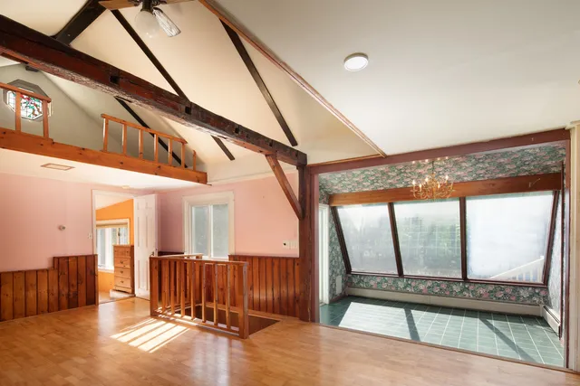 a view of an entryway with a floor to ceiling window