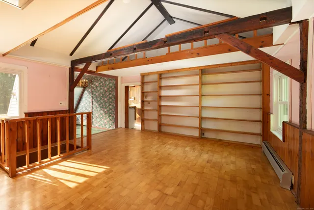 a view of a room with stairs and a window