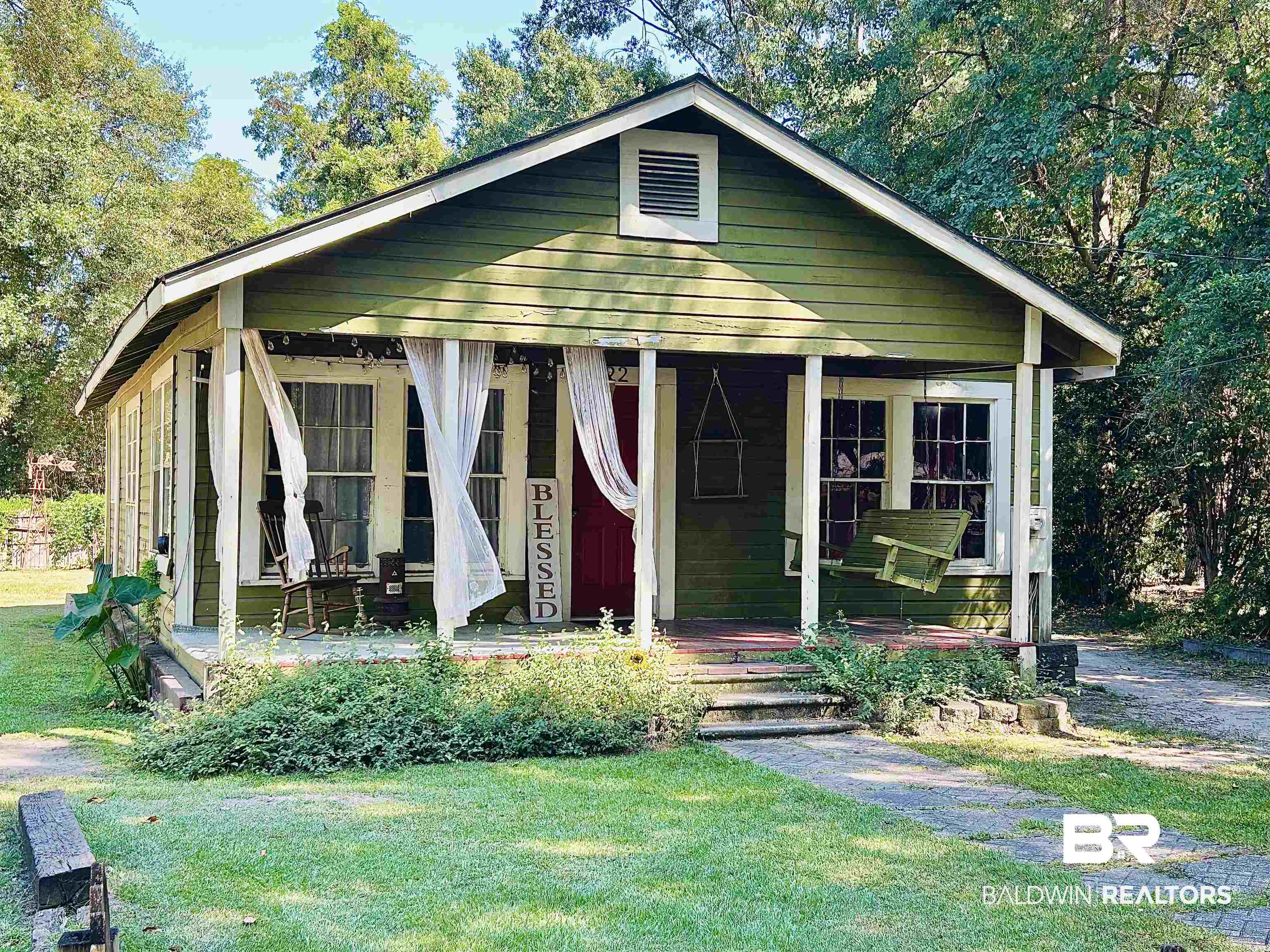 722 Conoley Avenue Brewton, AL 36426 - Photo 1 of 7 Bungalow-style house featuring a porch and a front yard