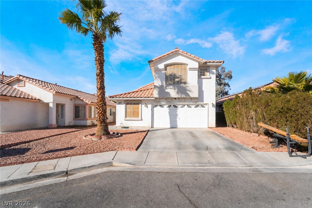 4411 Elk Point Circle Las Vegas, NV 89147 - Photo 1 of 40 This charming residence features a well-maintained exterior, a driveway, and a welcoming front of structure.