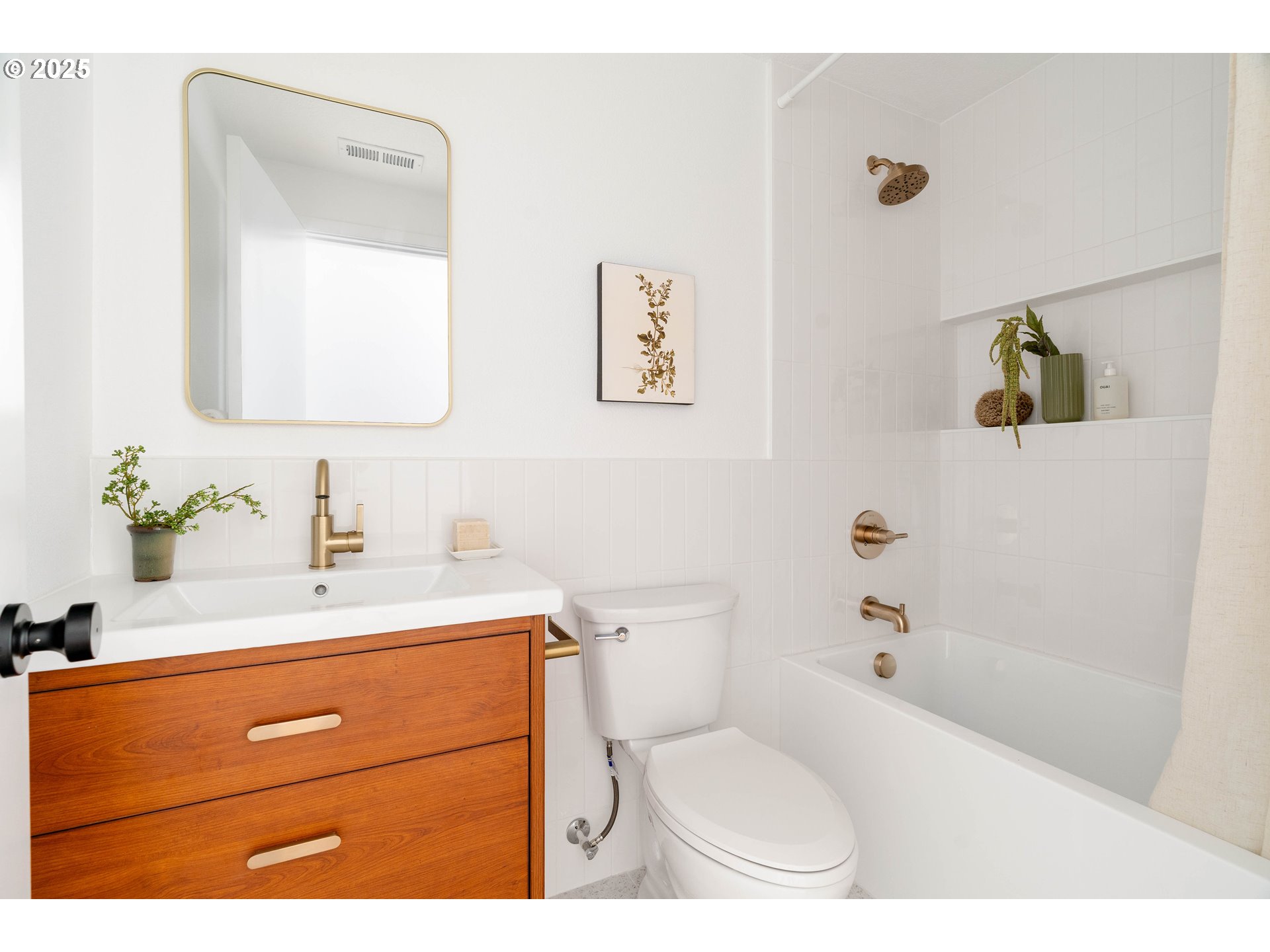 10904 Southwest 62nd Place Portland, OR 97219 - Photo 20 of 27 a bathroom with a sink a toilet and mirror