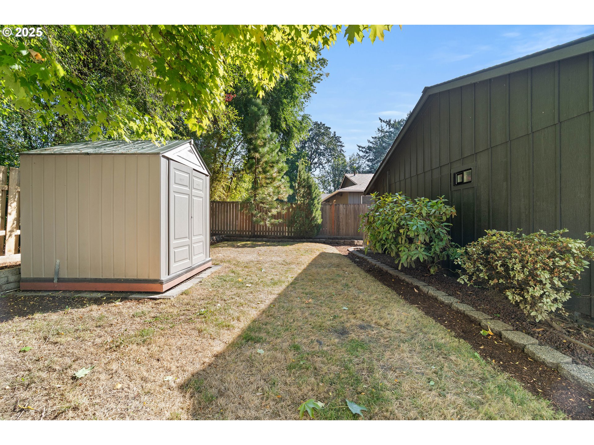 10904 Southwest 62nd Place Portland, OR 97219 - Photo 25 of 27 a backyard of a house with lots of green space