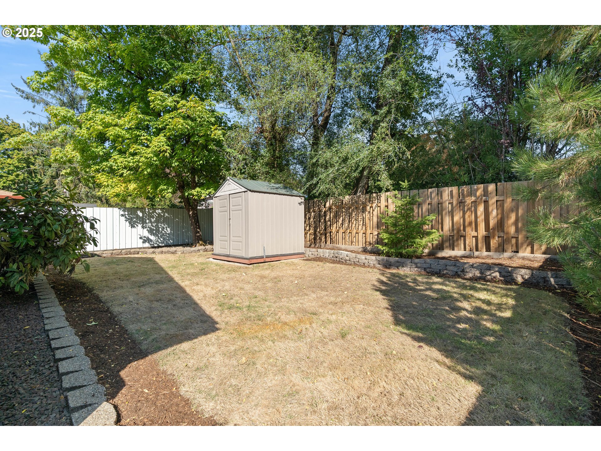 10904 Southwest 62nd Place Portland, OR 97219 - Photo 26 of 27 a view of a yard with plants and trees