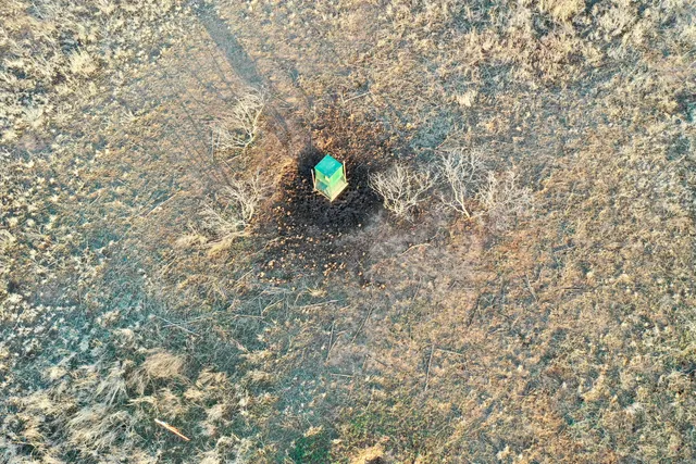an aerial view of beach and yard