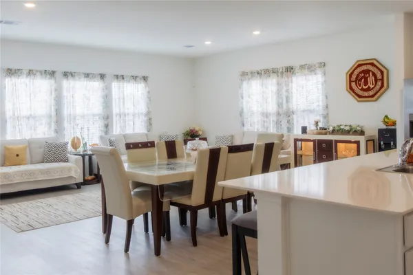 a view of a dining room with furniture and window
