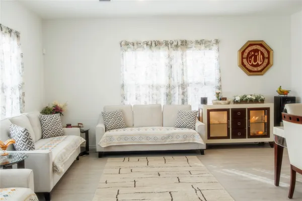 a living room with furniture and a table