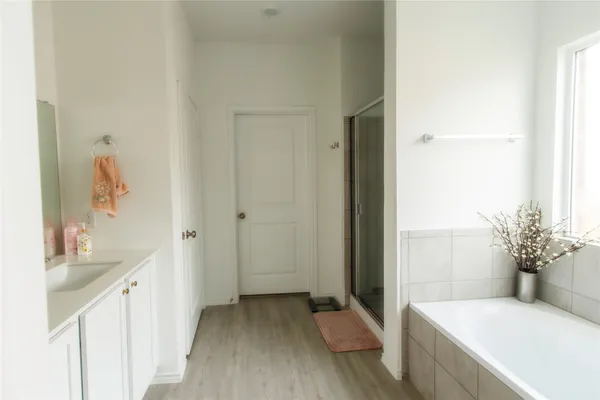 a bathroom with a sink and mirror