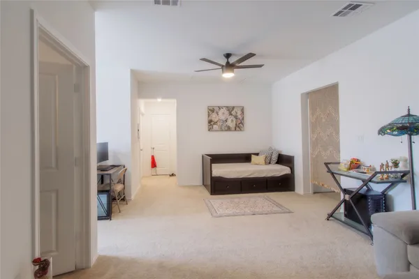 a bedroom with bed and a window