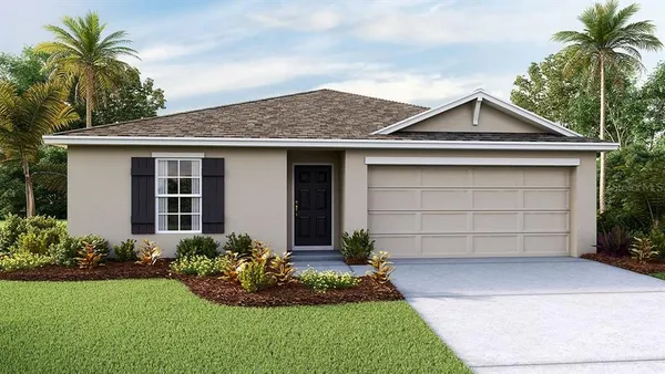 a front view of a house with a garden and garage