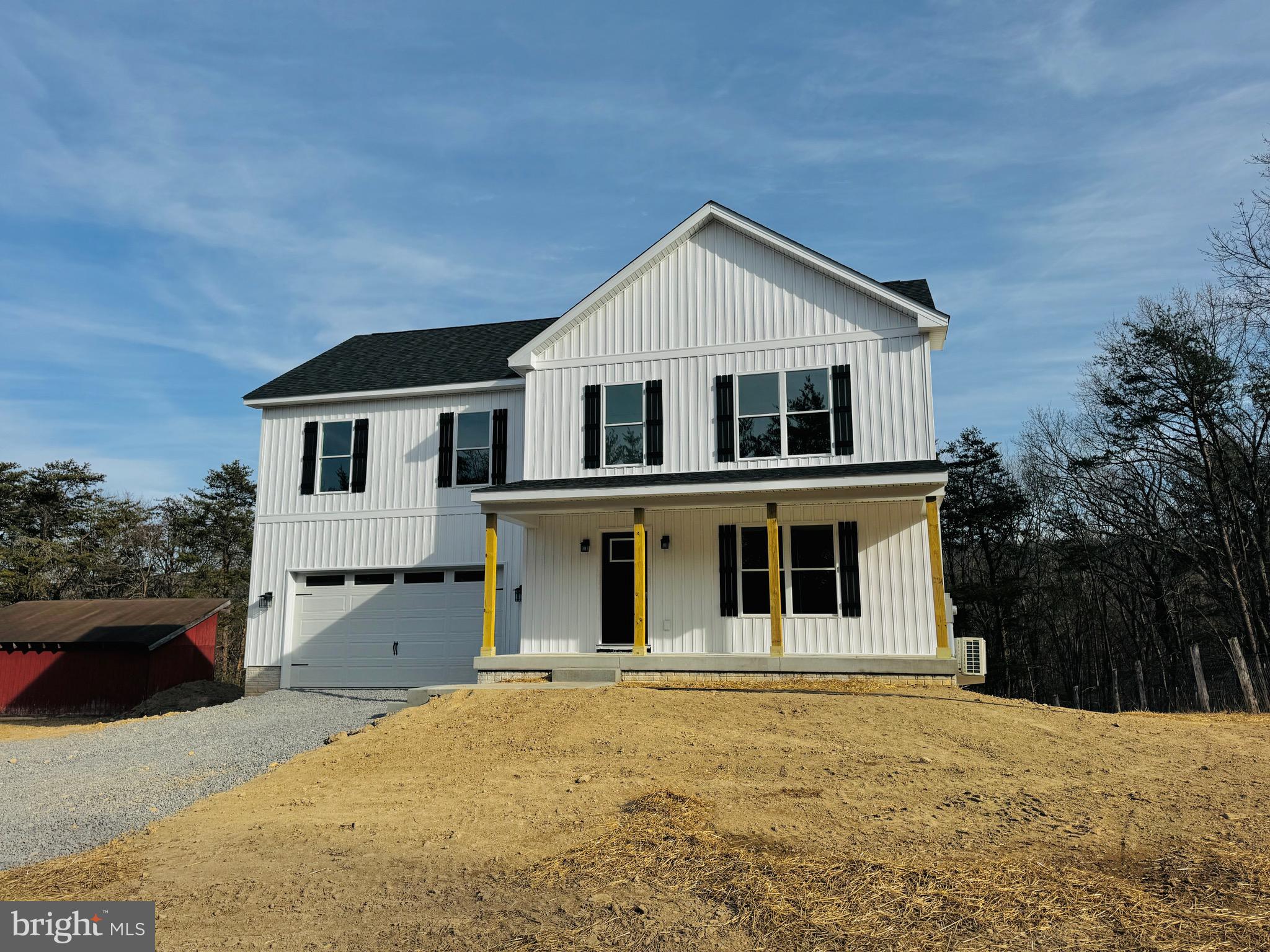 front view of a house with a yard