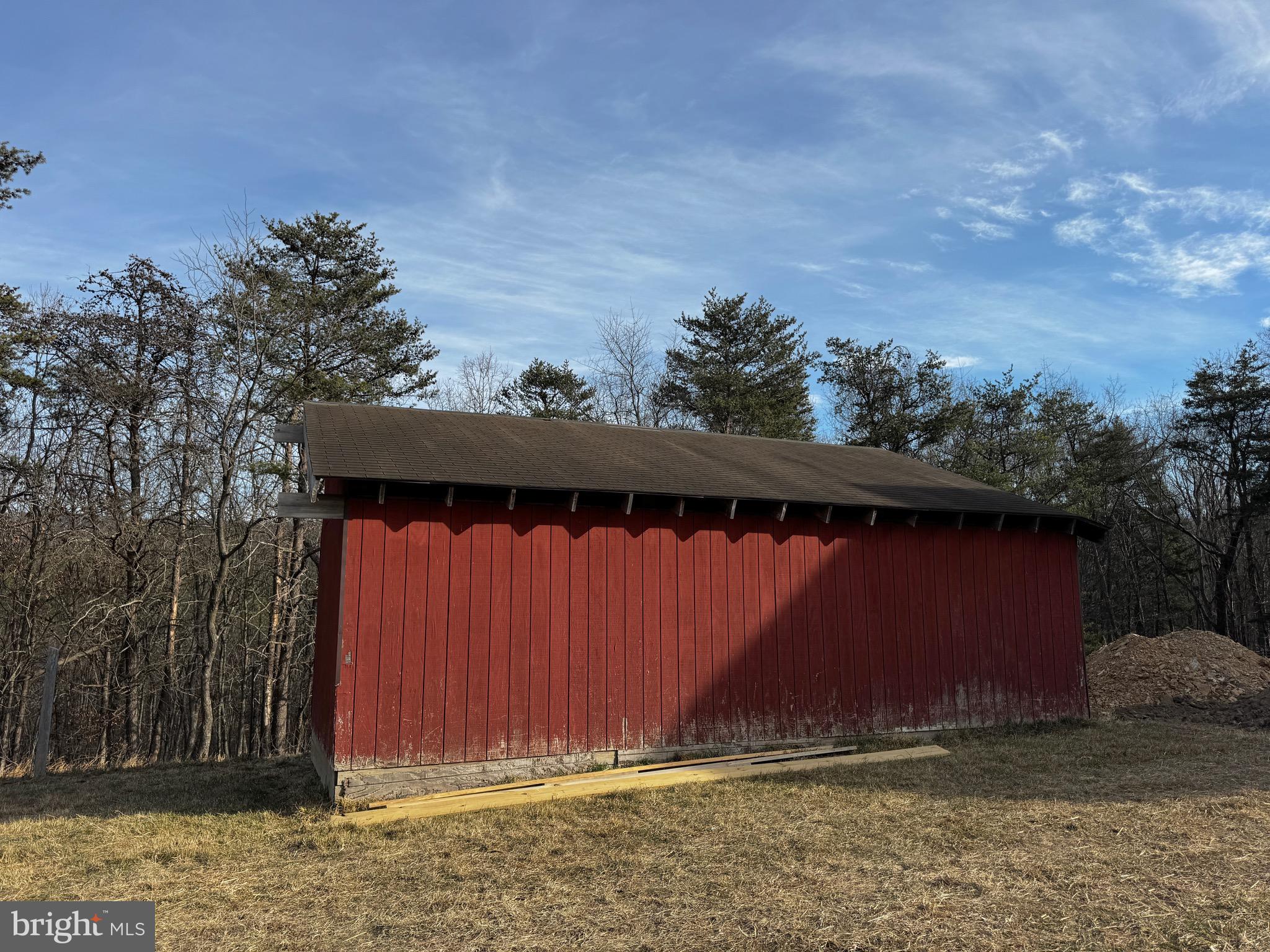 1241 Pine Grove Road Berkeley Springs, WV 25411 - Photo 2 of 19 a view of barn with wooden fence