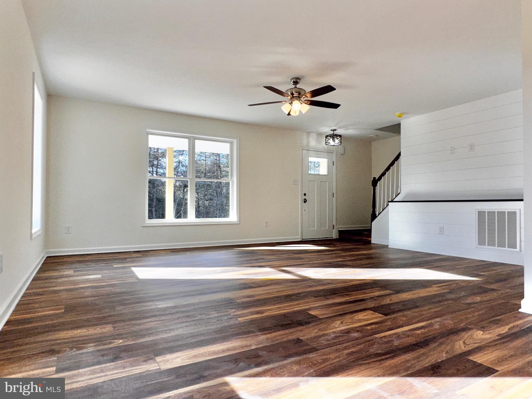 1241 Pine Grove Road Berkeley Springs, WV 25411 - Photo 9 of 19 a view of empty room with window and ceiling fan