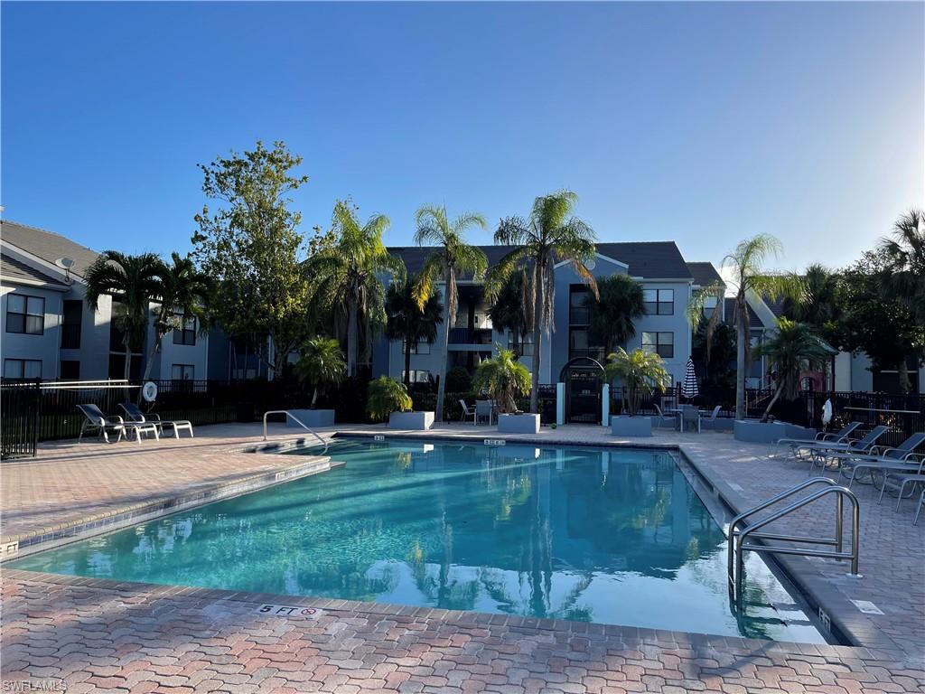 13521 Eagle Ridge Drive, Unit 133 Fort Myers, FL 33912 - Photo 11 of 15 a view of a swimming pool with a patio