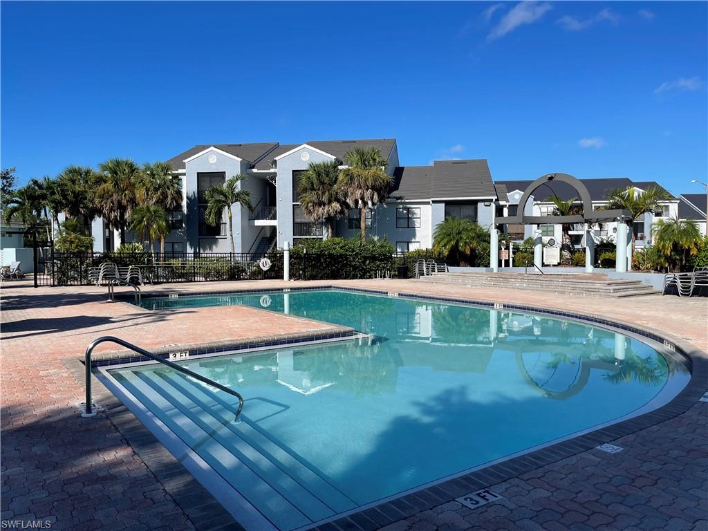 13521 Eagle Ridge Drive, Unit 133 Fort Myers, FL 33912 - Photo 10 of 15 a view of a swimming pool with a patio