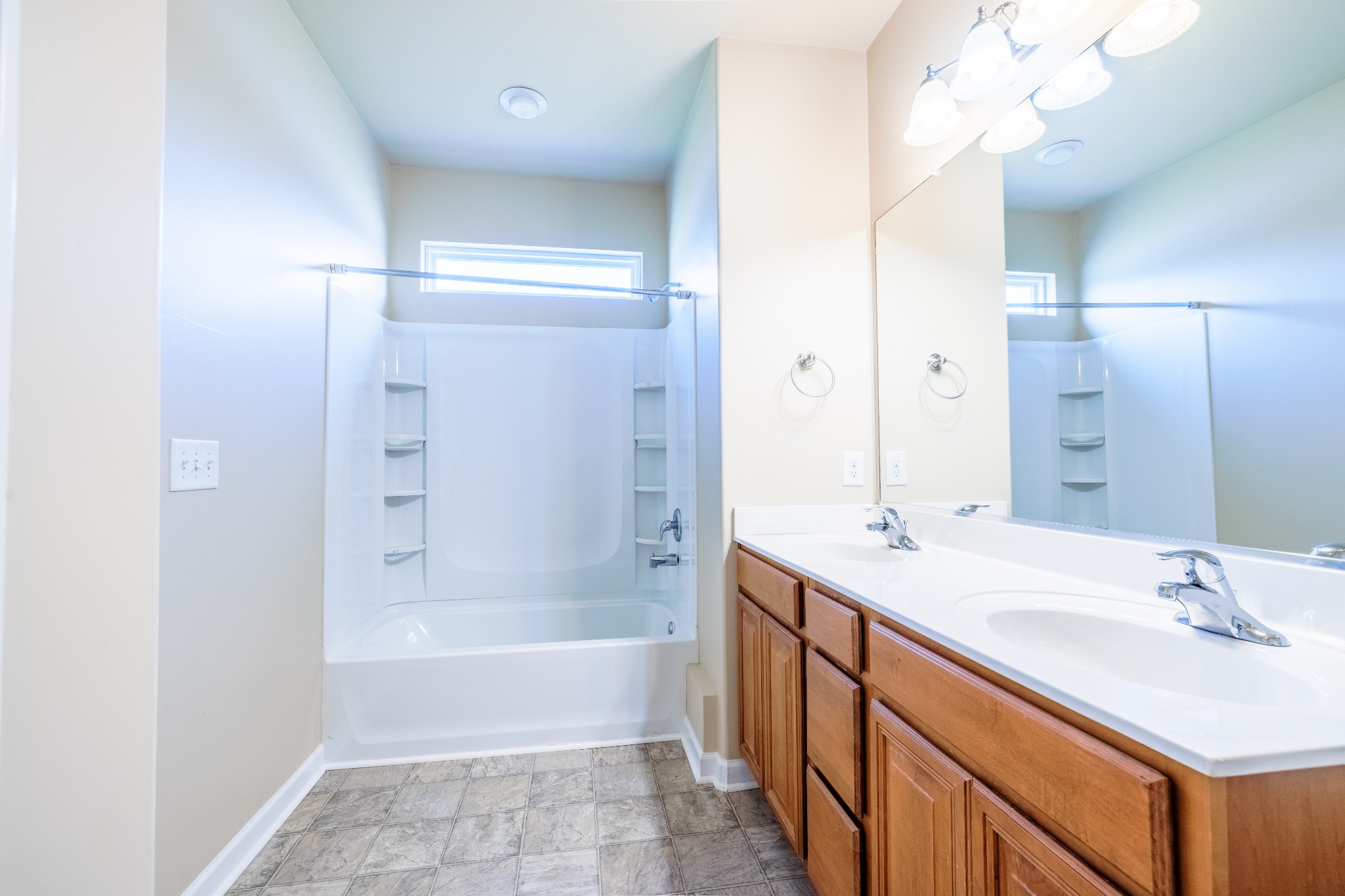 3799 Willow Creek Road Nashville, TN 37207 - Photo 13 of 25 a bathroom with a tub sink and mirror
